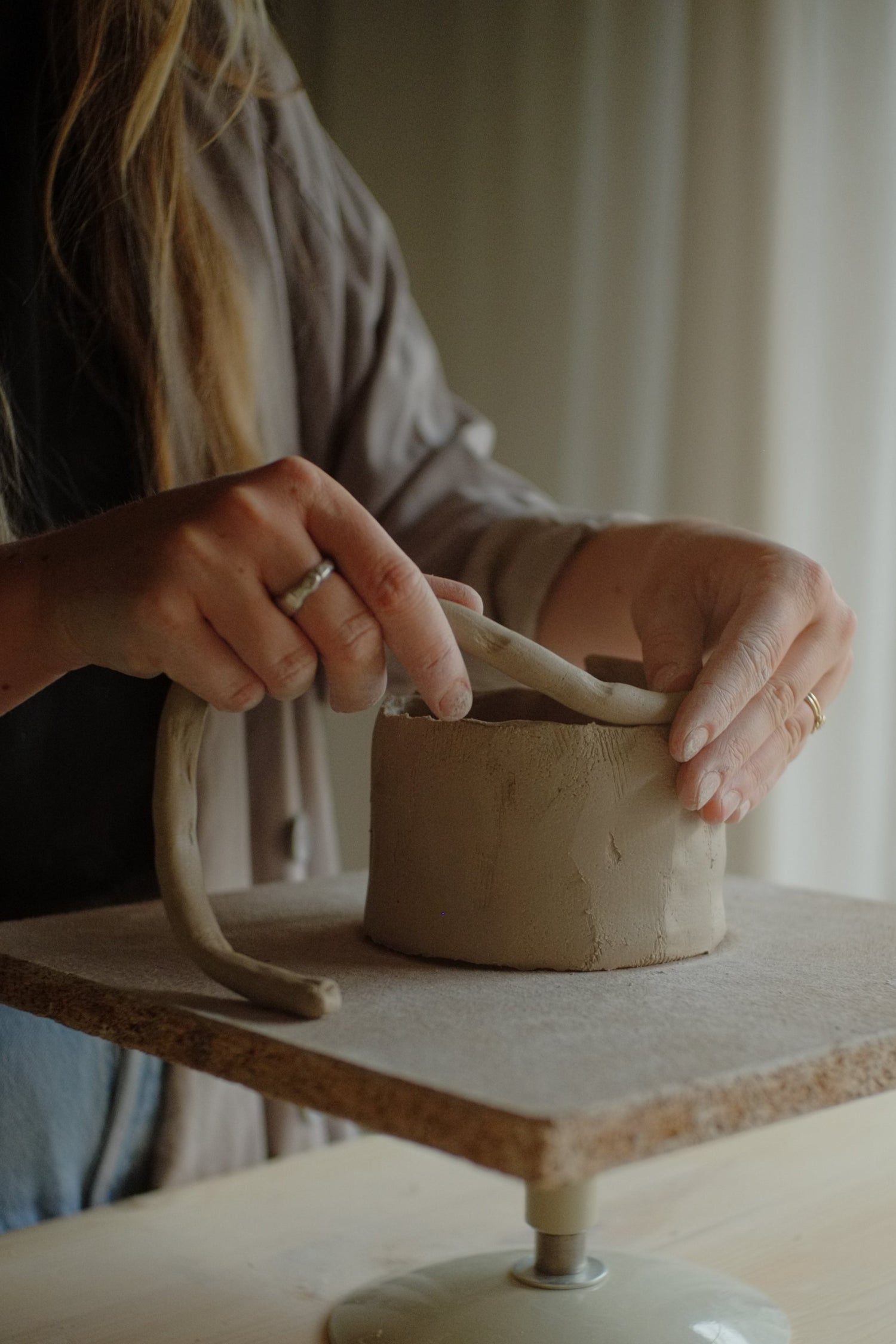 Person working with clay 